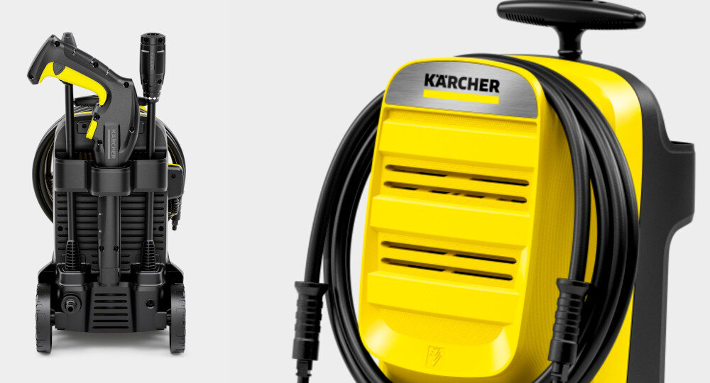 Na obrazie widoczna jest żółta myjka ciśnieniowa z czarnymi elementami, z logo \'KARCHER\' na górze. Myjka ma zamocowany wąż i pistolet natryskowy.