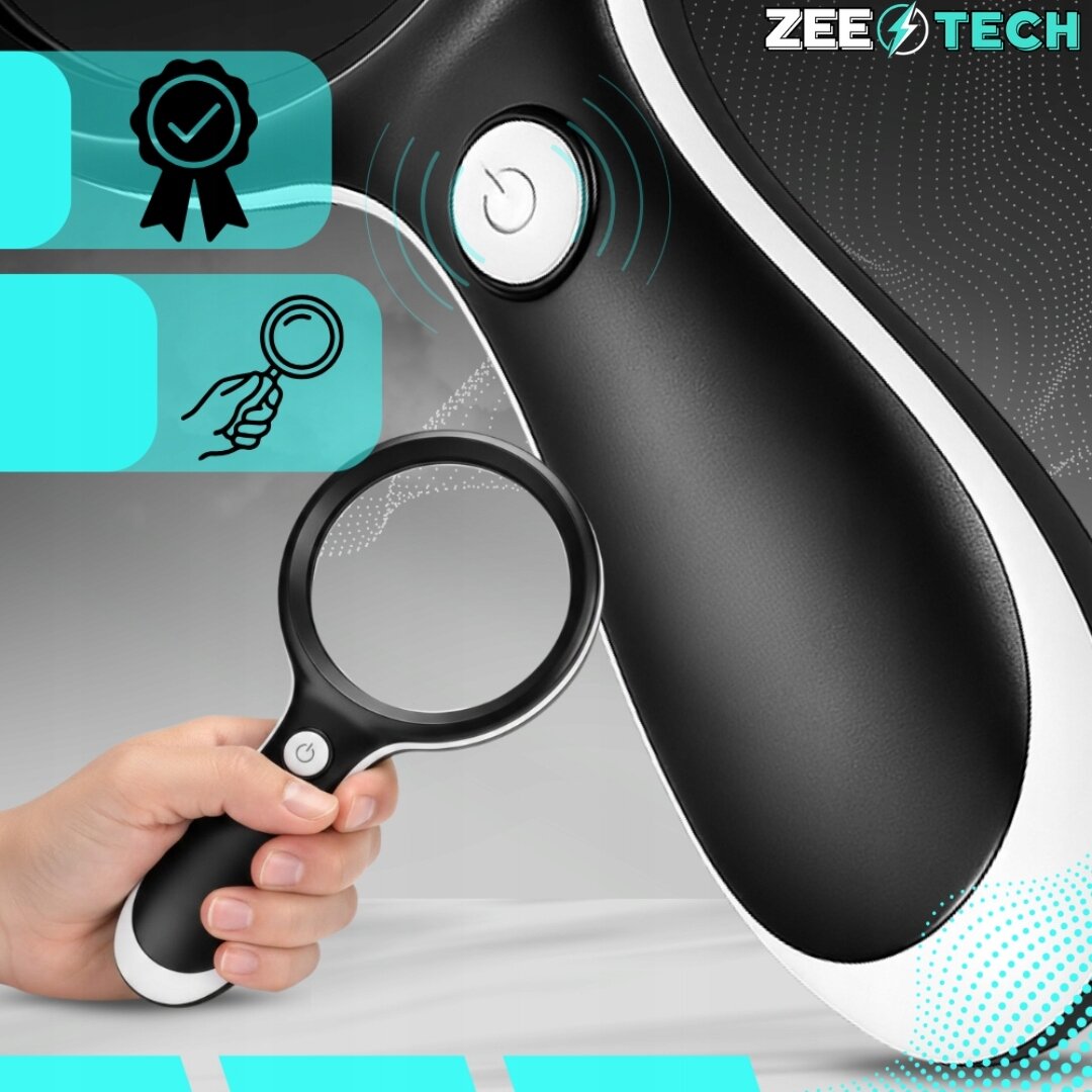 Obraz przedstawia czarną lupę z białym przyciskiem na uchwycie, trzymaną w dłoni. W prawym górnym rogu widoczne jest logo \'ZEETECH\'.