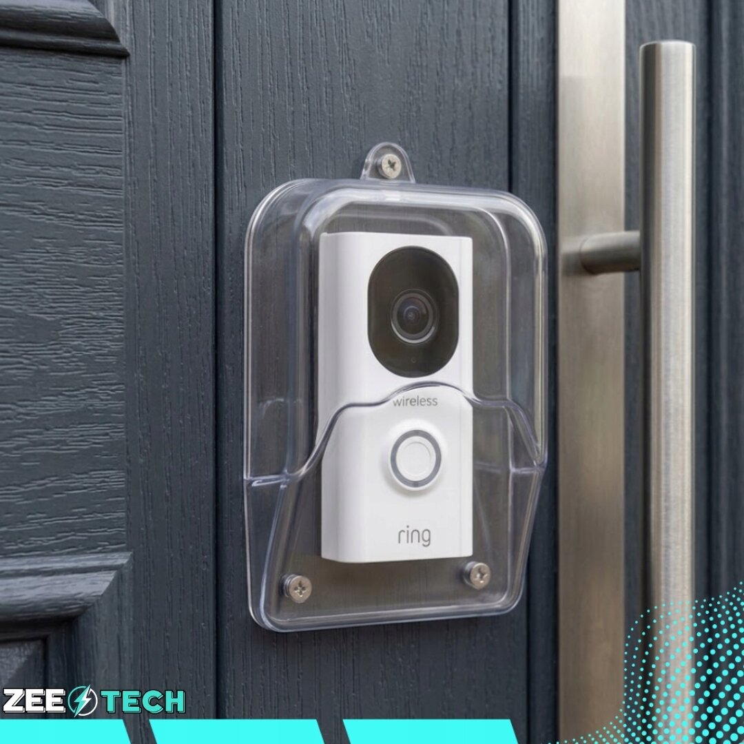 Na ciemnych drzwiach zamontowany jest biały dzwonek bezprzewodowy z przezroczystą osłoną. Widoczne są napisy \'wireless\' i \'ring\', a w dolnym rogu logo \'ZEETECH\'.