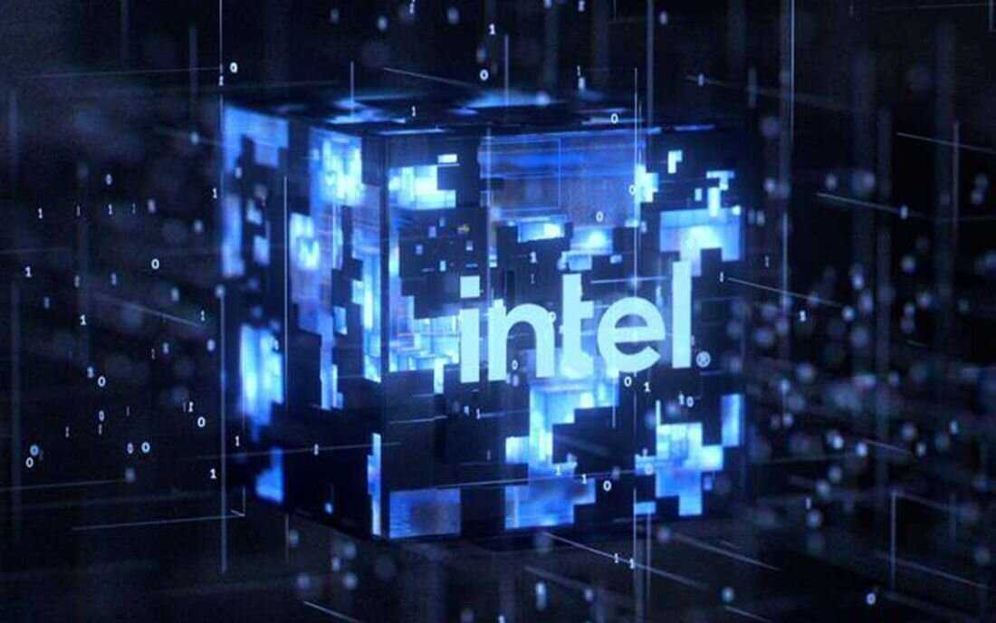 Obraz przedstawia niebieski, cyfrowy sześcian z napisem \'intel\'. Wokół sześcianu widoczne są cyfry i linie, tworzące efekt technologiczny.