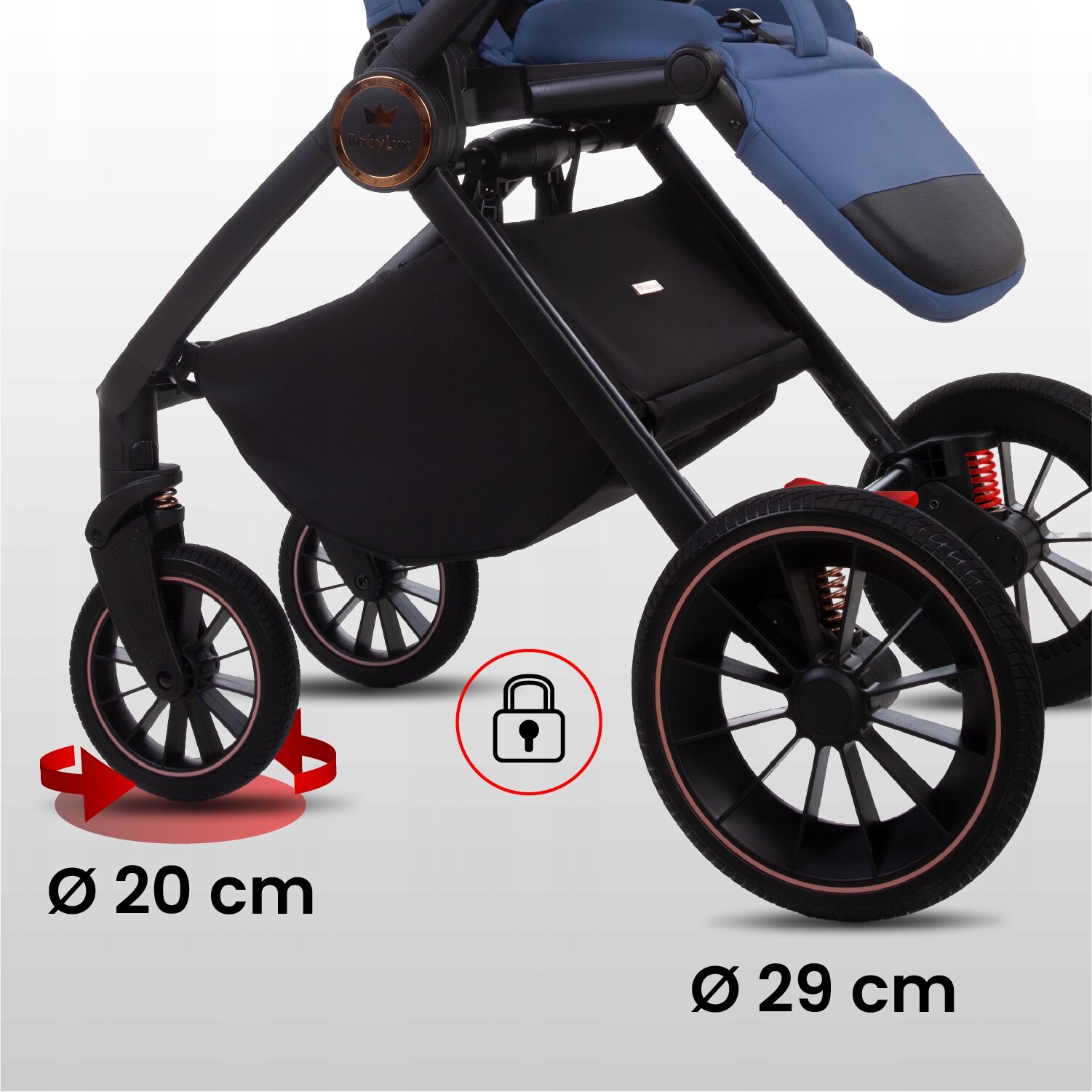 Obraz przedstawia dolną część wózka dziecięcego z czarnymi kołami o średnicach 20 cm i 29 cm. Na obrazie widoczna jest również ikona kłódki oraz napis \'Ø 20 cm\' i \'Ø 29 cm\'.