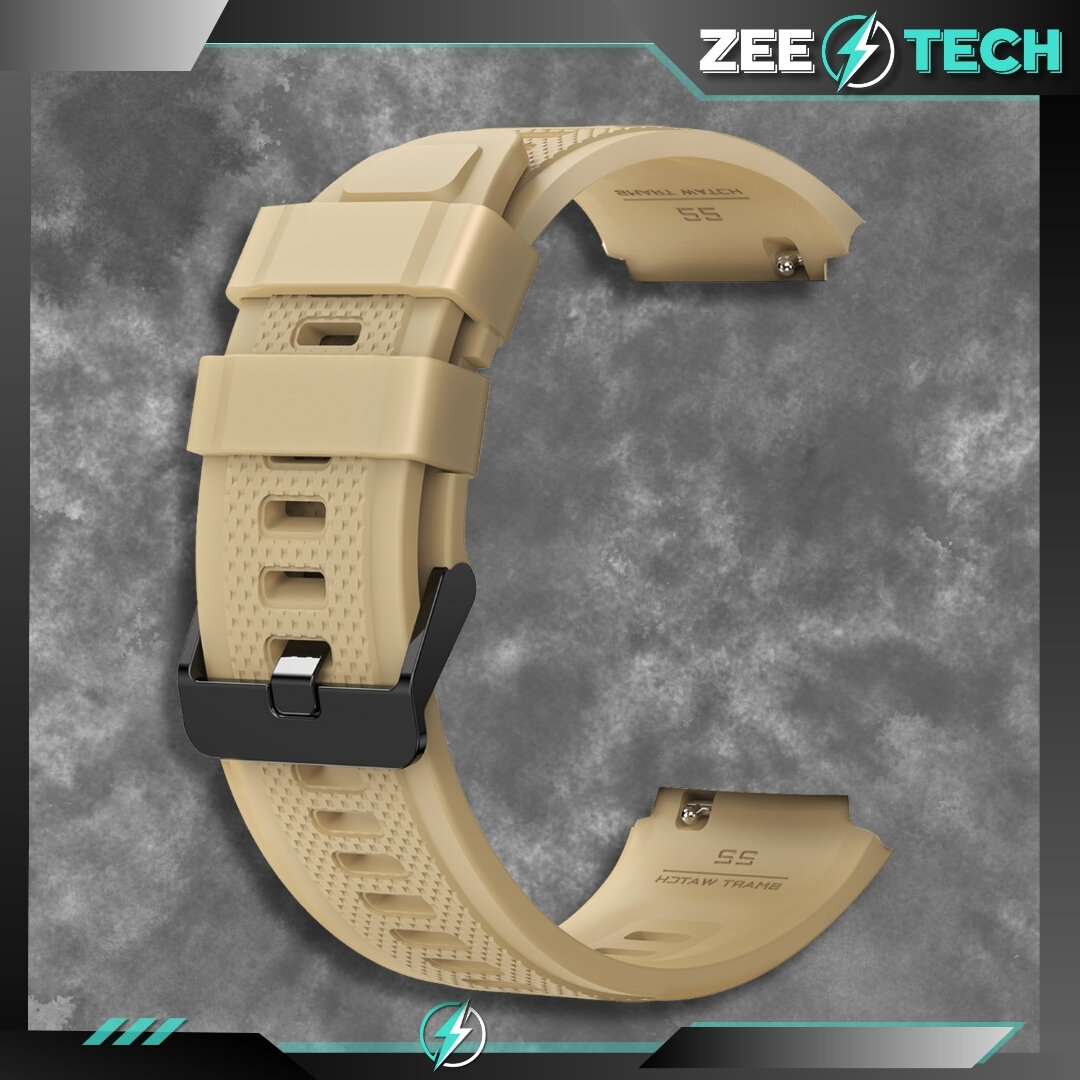 Beżowy silikonowy pasek do zegarka z czarną klamrą, widoczny na tle szarej tekstury. Logo \'ZEETECH\' znajduje się w prawym górnym rogu.