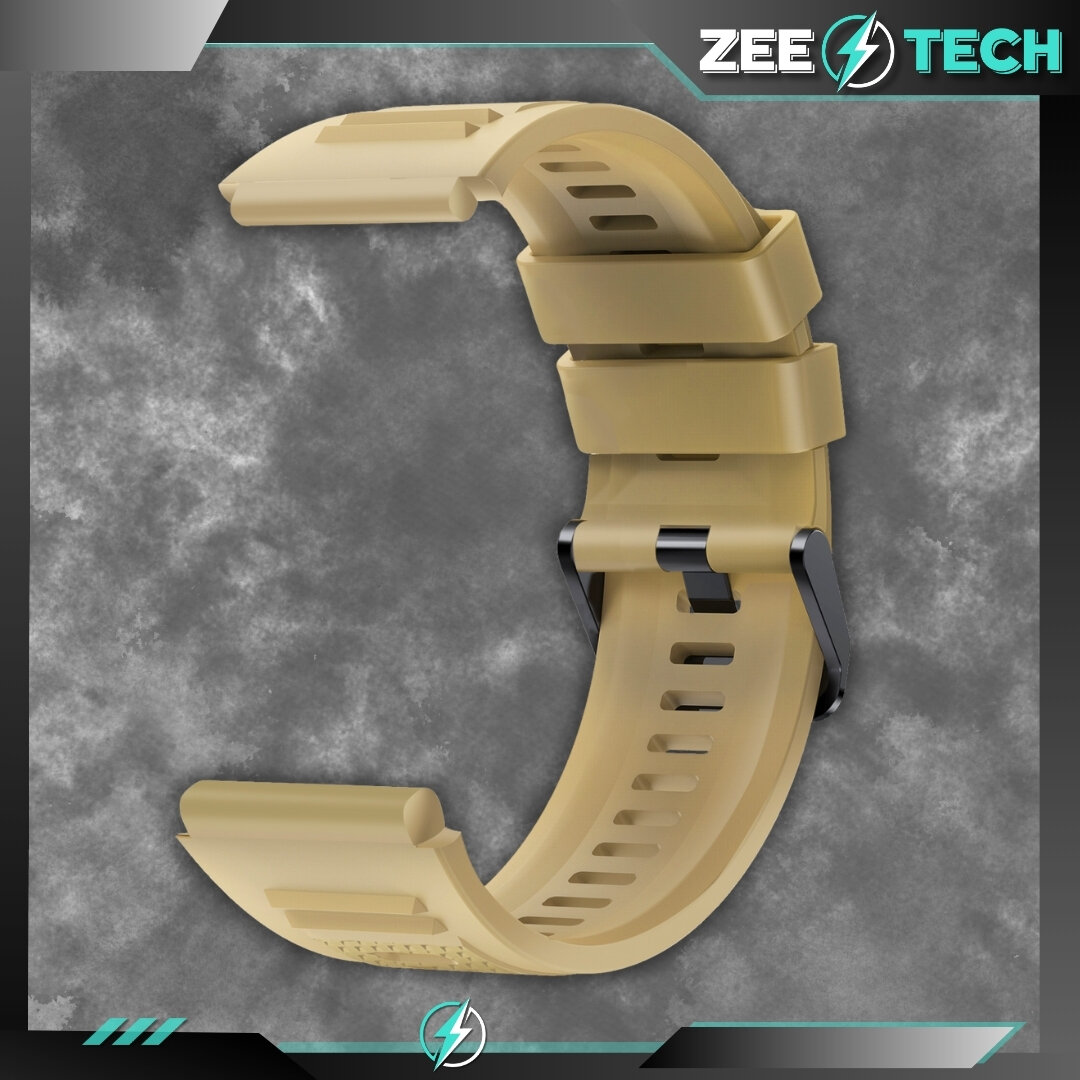 Beżowy silikonowy pasek do zegarka z widocznymi otworami wentylacyjnymi i metalowym zapięciem. W prawym górnym rogu znajduje się logo \'ZEETECH\'.