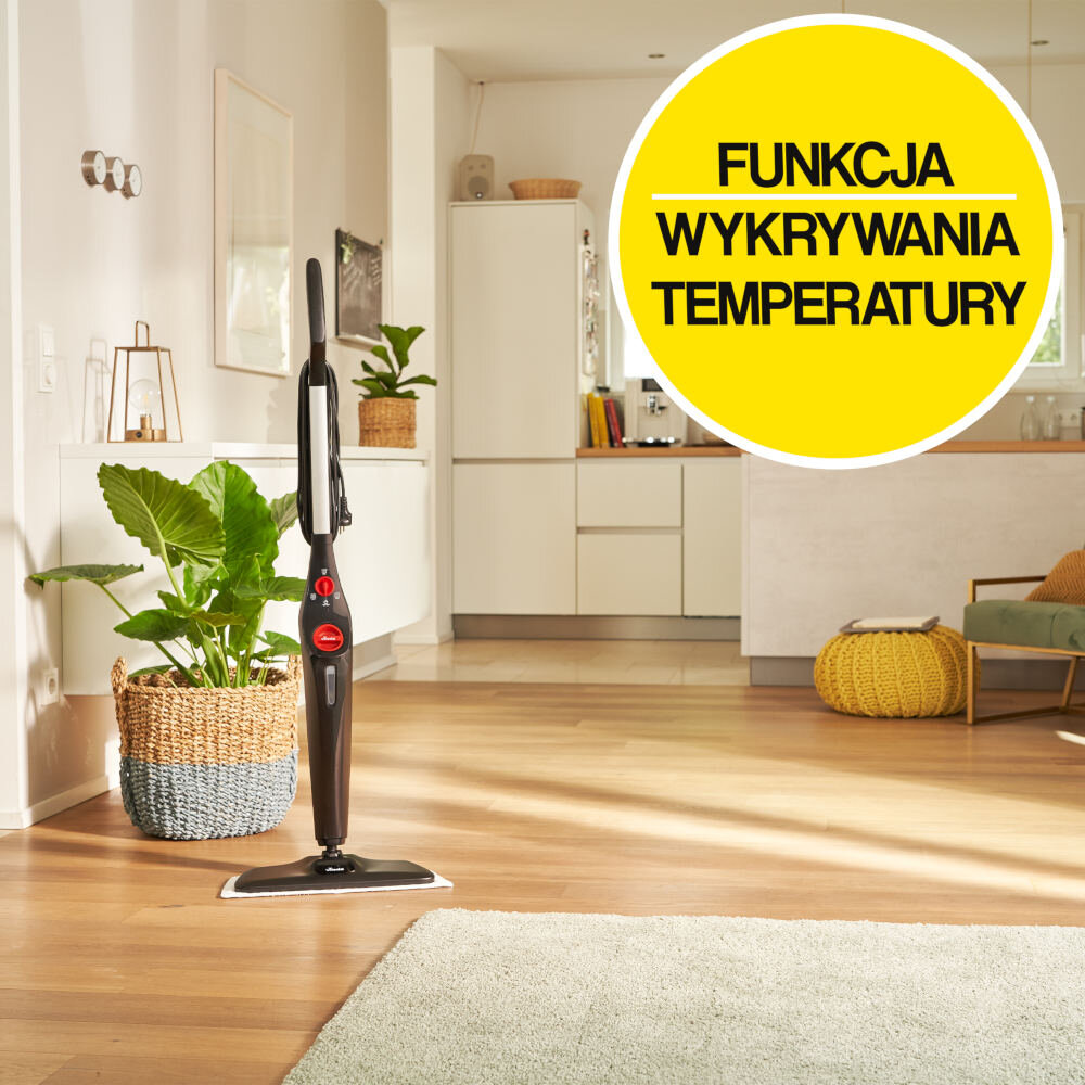 W jasnym wnętrzu kuchni stoi mop parowy obok dużej rośliny w plecionym koszu. Na żółtym tle widnieje napis: \'FUNKCJA WYKRYWANIA TEMPERATURY\'.