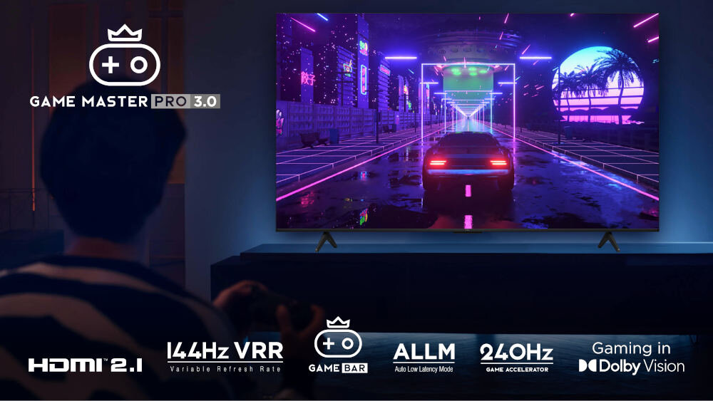 Na obrazie widać telewizor wyświetlający grę z neonowymi kolorami i samochodem na ekranie. Na dole znajdują się napisy: \'GAME MASTER PRO 3.0\', \'HDMI 2.1\', \'144Hz VRR\', \'GAME BAR\', \'ALLM\', \'240Hz\', \'Gaming in Dolby Vision\'.