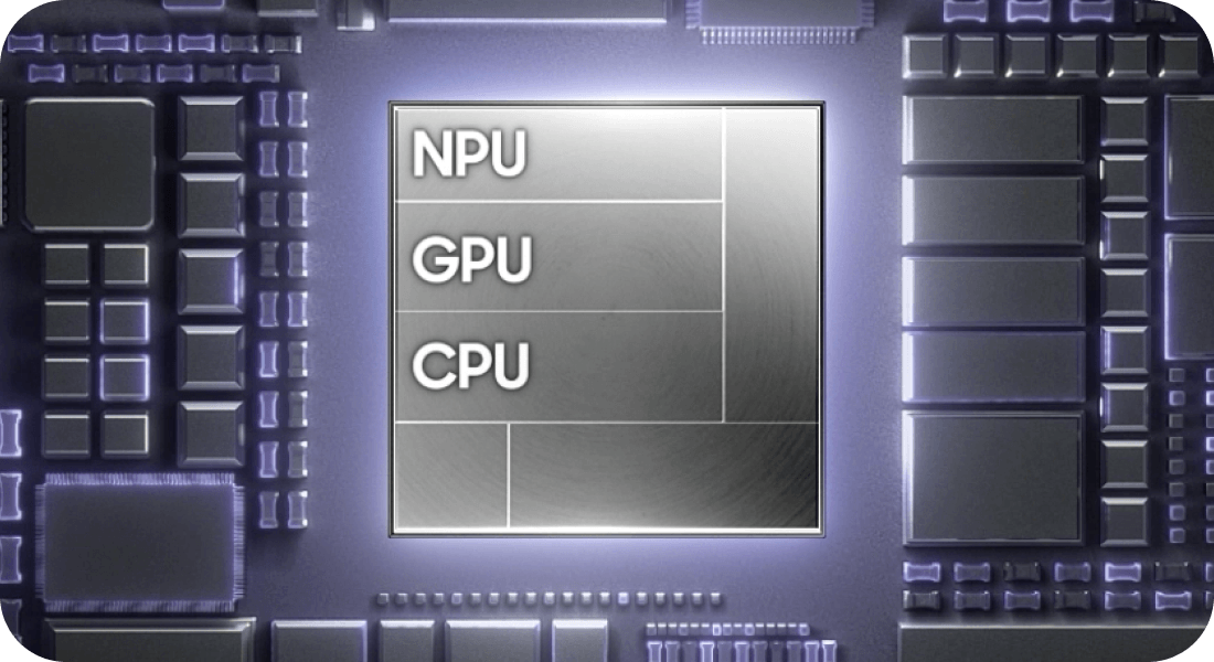 Przekrój procesora z oznaczeniami procesora graficznego, głównego obliczeniowego oraz uczenia maszynowego Obraz przedstawia schemat układu scalonego z widocznymi napisami: NPU, GPU, CPU. Układ jest otoczony różnymi komponentami elektronicznymi.