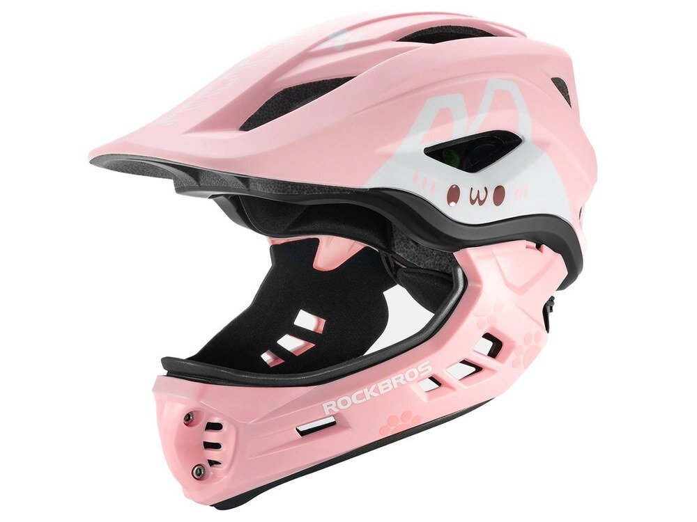Różowy kask rowerowy z odkręcaną szczęką, ozdobiony grafiką króliczych uszu i twarzy. Na kasku widoczne jest logo \'ROCKBROS\'.