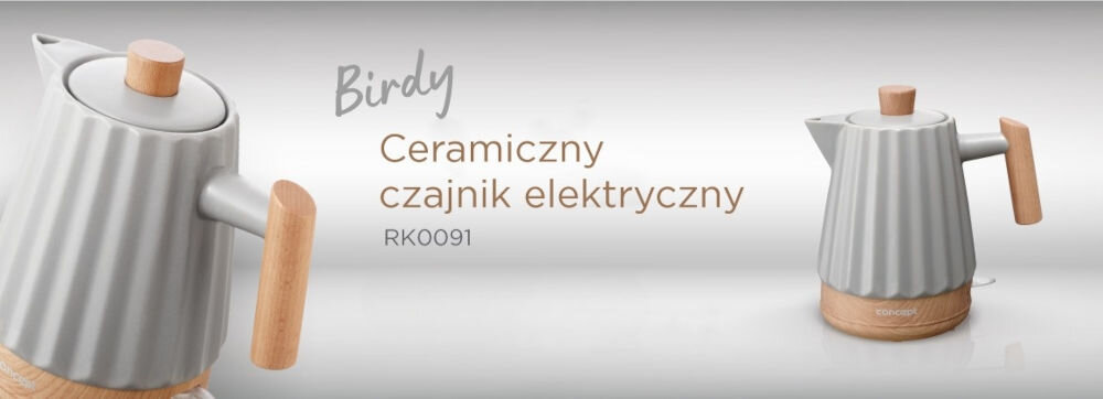 Obraz przedstawia jasnoszary, ceramiczny czajnik elektryczny z drewnianymi elementami. Na obrazie widoczny jest tekst: \'Birdy Ceramiczny czajnik elektryczny RK0091\'.