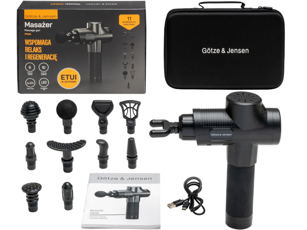 Na obrazie znajduje się masażer ręczny z różnymi wymiennymi końcówkami oraz etui z napisem \'Götze & Jensen\'. Widoczny jest także kabel USB oraz instrukcja obsługi z ilustracją masażera.