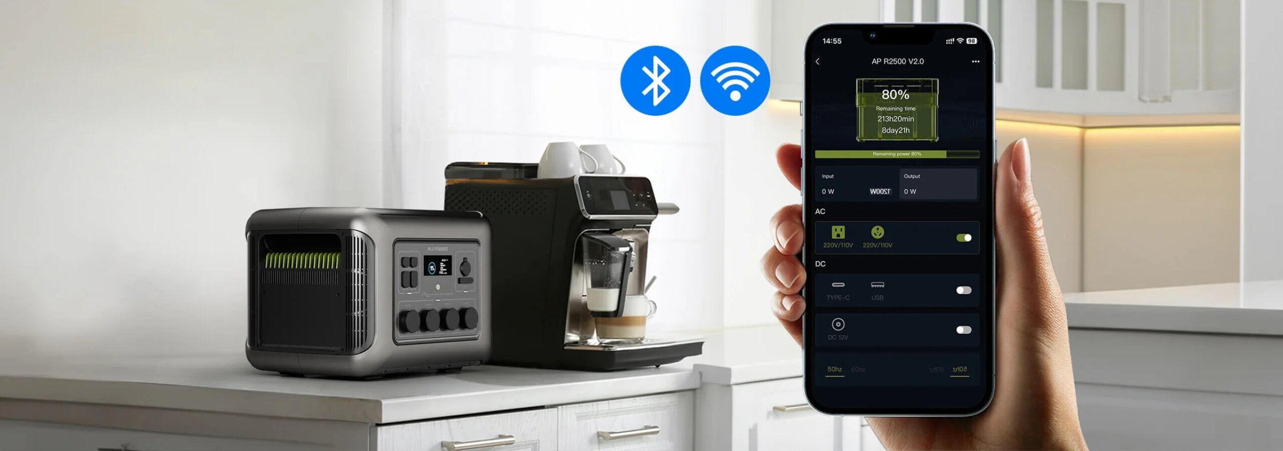 Na blacie kuchennym znajduje się ekspres do kawy oraz urządzenie przypominające generator prądu. Obok widoczny jest smartfon z aplikacją pokazującą stan naładowania na poziomie 80% oraz ikony Bluetooth i Wi-Fi.