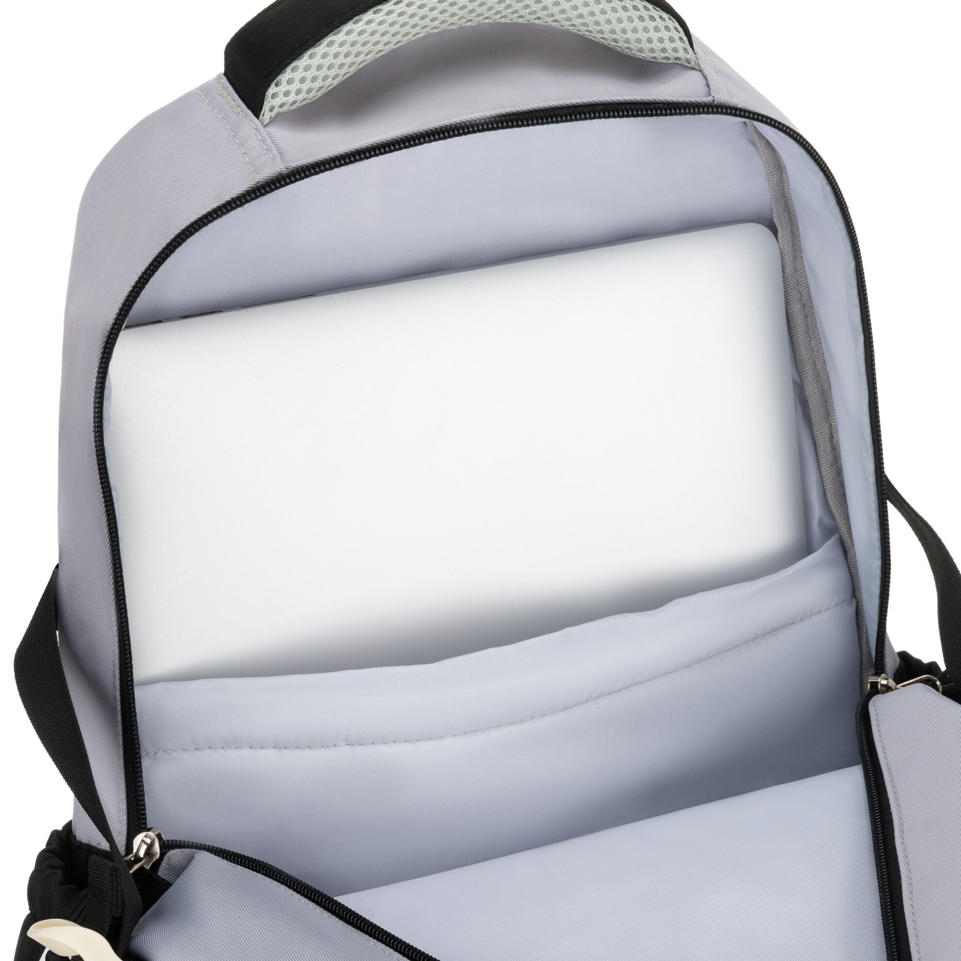 Wnętrze plecaka z otwartą komorą, w której znajduje się przegroda na laptopa. Materiał jest jasnoszary, a zamek błyskawiczny jest czarny.