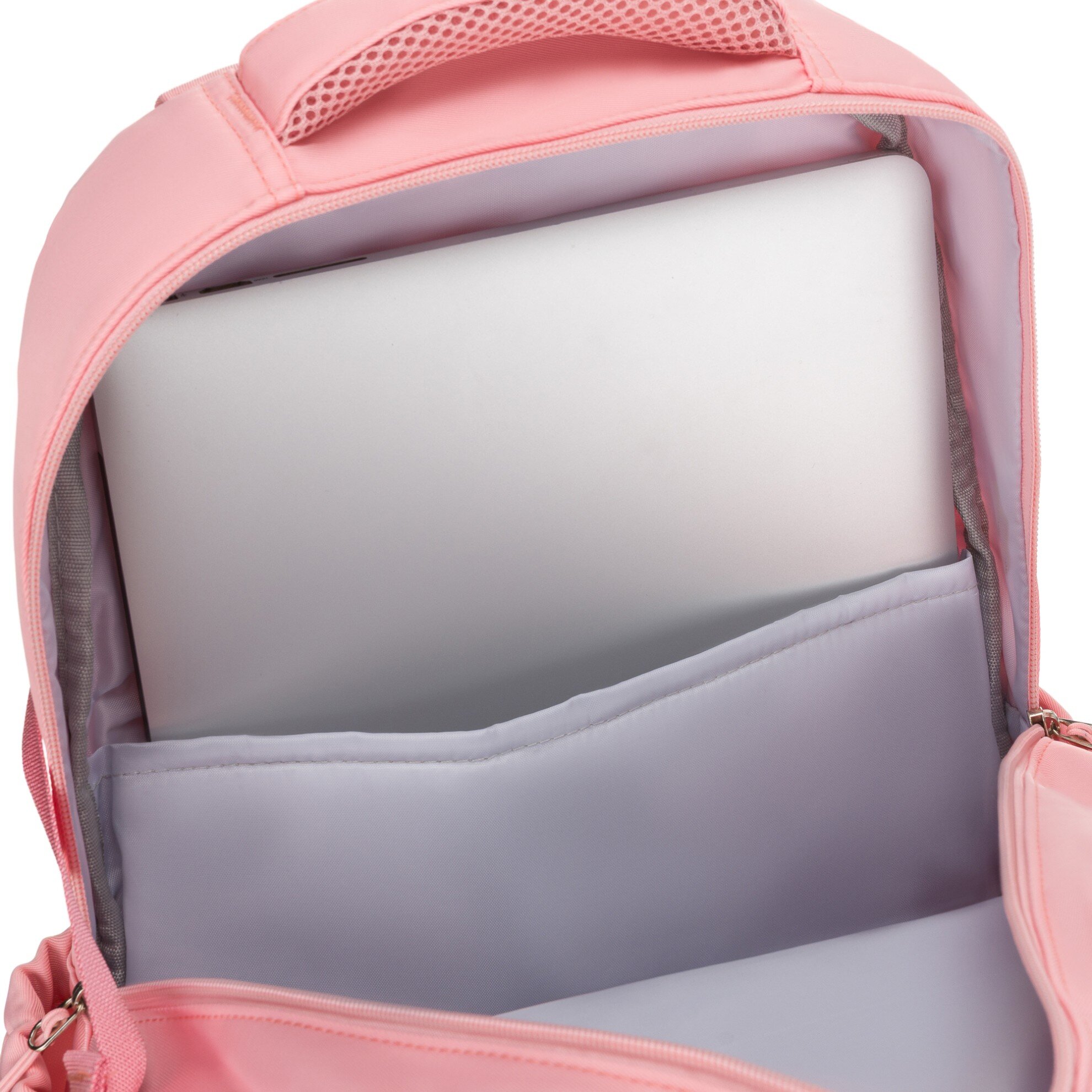 Różowy plecak z otwartą komorą, w której znajduje się laptop. Wnętrze plecaka jest wyściełane jasnym materiałem.