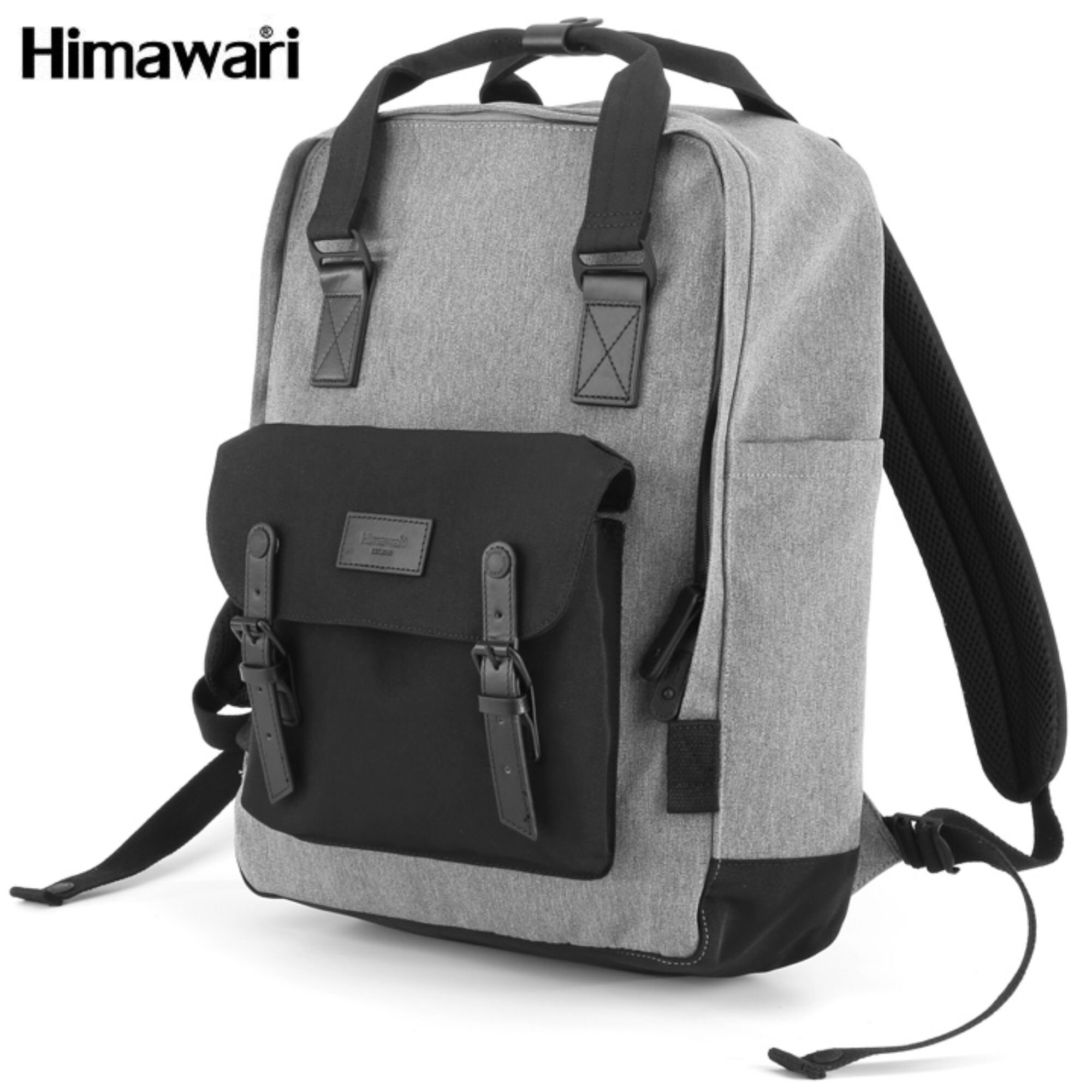 Szaro-czarny plecak z miejscem na laptopa, z przodu posiada czarną kieszeń z klapą i paskami. Logo \'Himawari\' widoczne w górnym rogu.