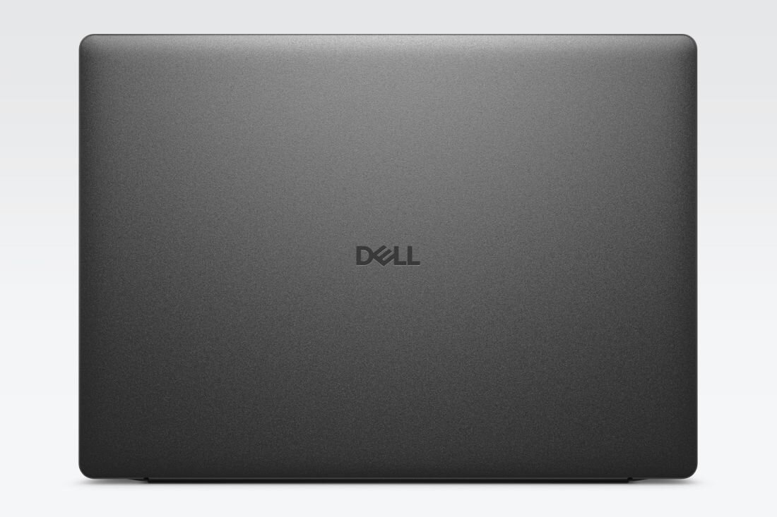 Obraz przedstawia zamknięty laptop w kolorze ciemnoszarym z widocznym logo \'DELL\' na środku pokrywy.