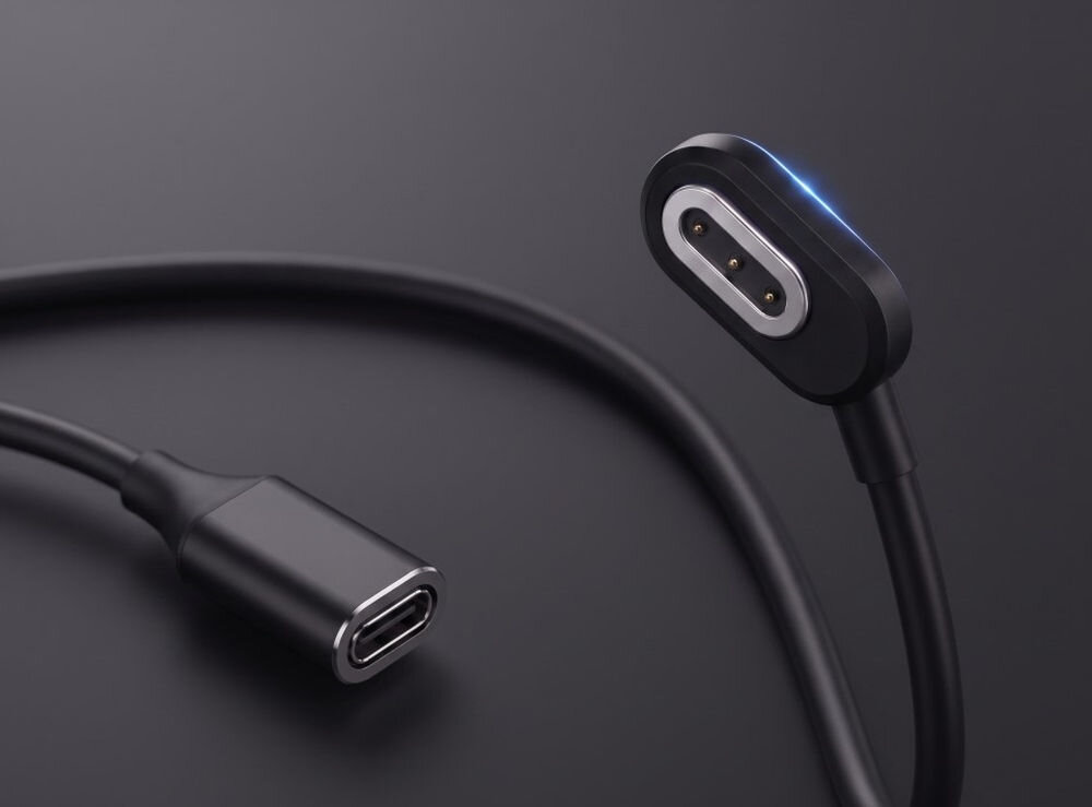 Obraz przedstawia czarny kabel ładujący z magnetycznym złączem i końcówką USB-C na ciemnym tle.