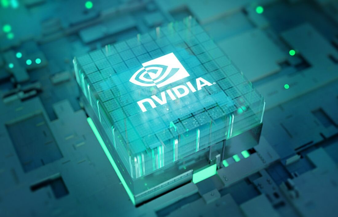 Obraz przedstawia stylizowany układ scalony z logo \'nvidia\' na powierzchni, otoczony niebiesko-zielonym światłem.