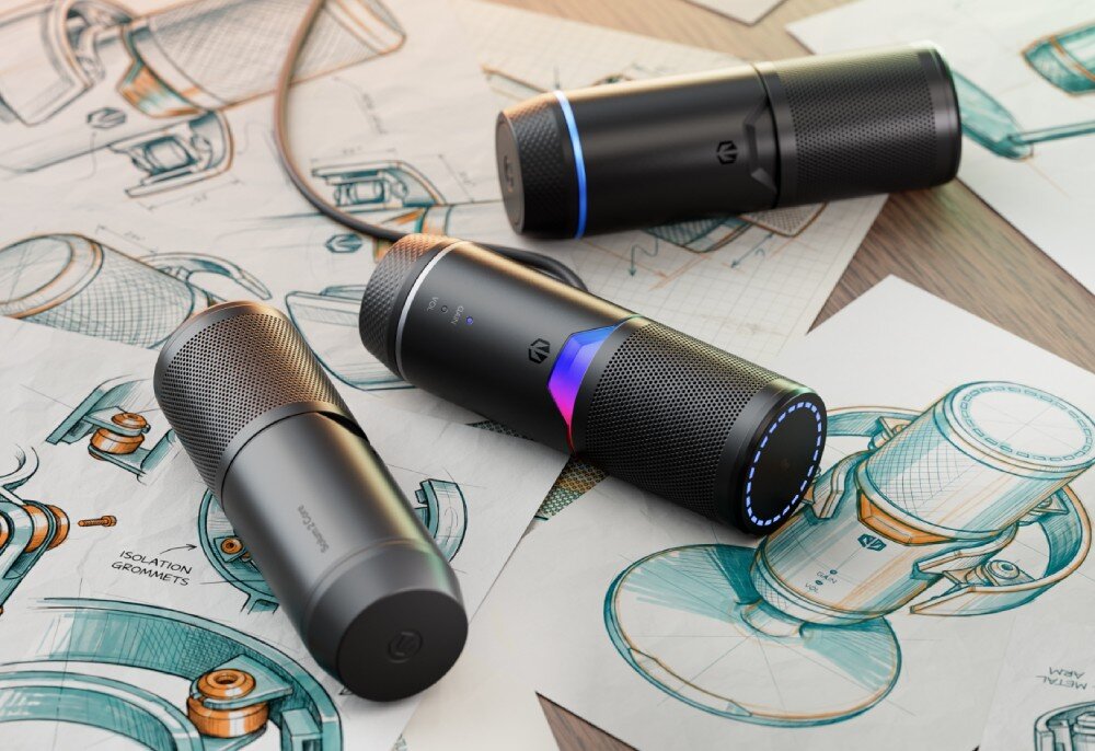 Mikrofon ENDORFY Solum 2 Boom Arm Trzy mikrofony leżące na rysunkach technicznych i szkicach koncepcyjnych