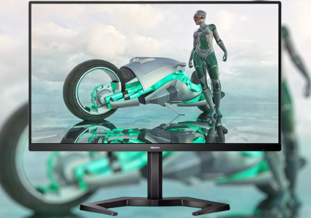 Monitor wyświetla grafikę przedstawiającą futurystyczny motocykl i postać w kombinezonie. Na ramce monitora widoczne jest logo \'PHILIPS\'.