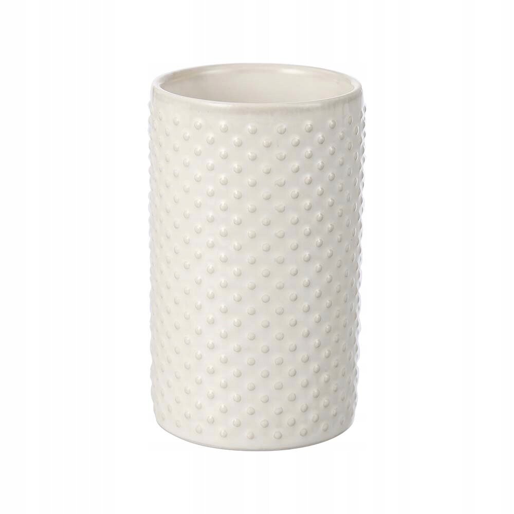 Biały, ceramiczny kubek o cylindrycznym kształcie z wypukłymi kropkami na powierzchni.