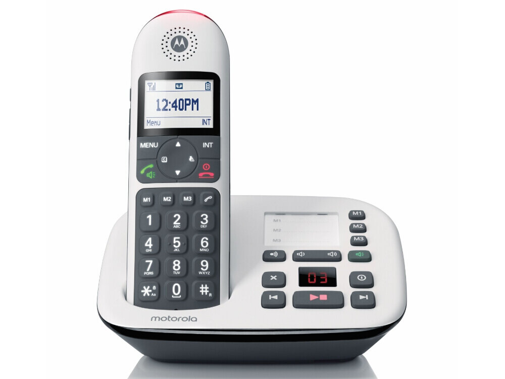 Biały telefon stacjonarny z dużymi przyciskami i wyświetlaczem pokazującym godzinę 12:40PM. Na stacji dokującej widoczne są przyciski funkcyjne oraz logo Motorola.