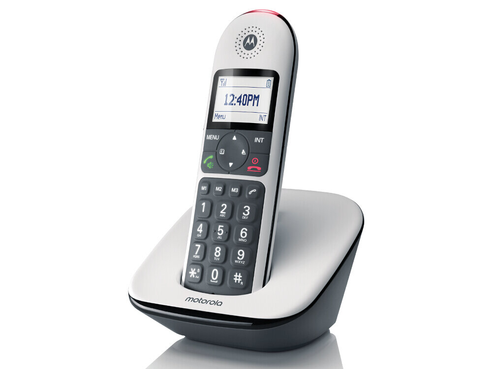 Biały telefon bezprzewodowy z wyświetlaczem pokazującym godzinę 12:40PM, umieszczony na stacji dokującej. Na górze telefonu widoczne jest logo Motorola.