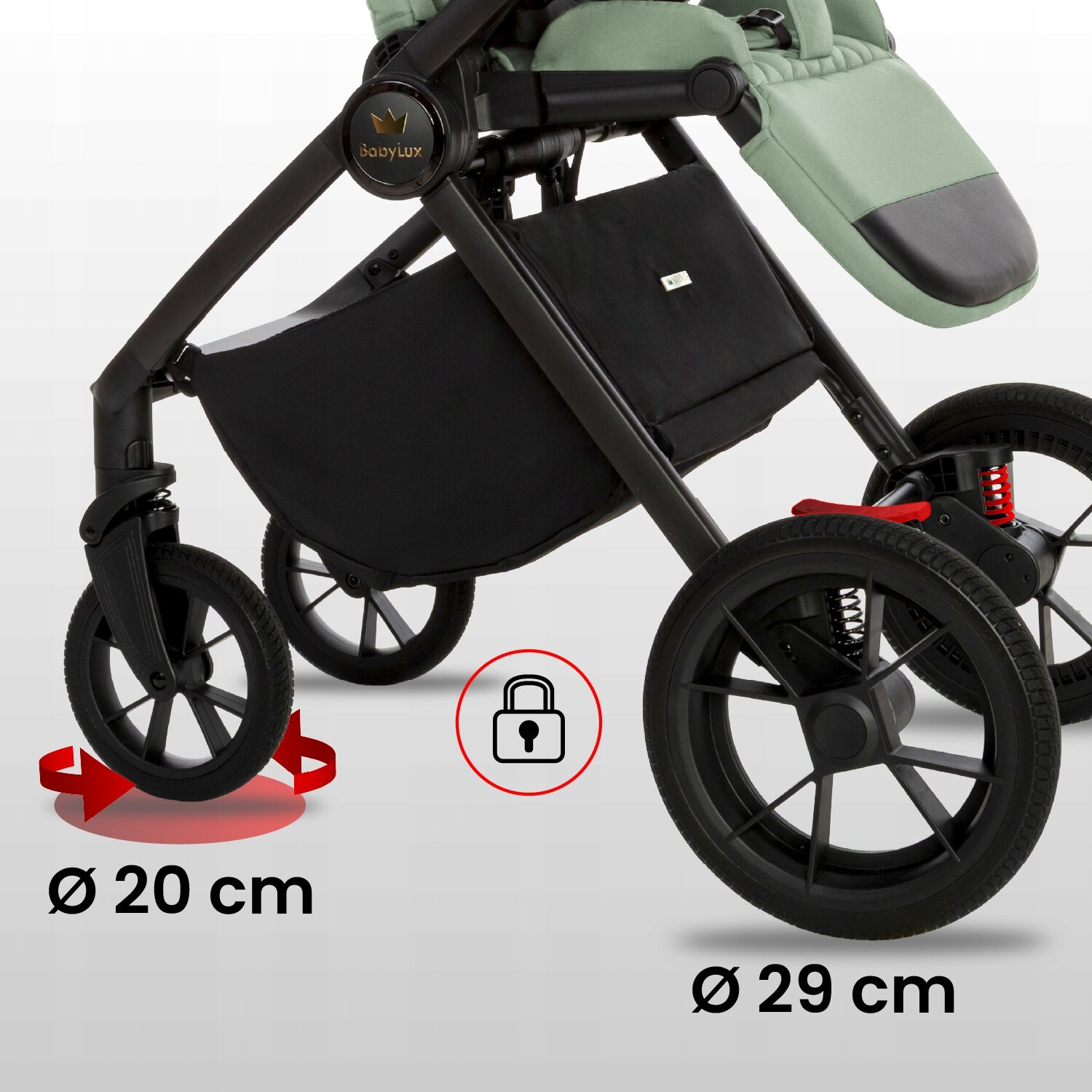 Obraz przedstawia dolną część wózka dziecięcego z czarnymi kołami i zielonym siedziskiem. Widoczne są oznaczenia średnicy kół: 20 cm i 29 cm oraz ikona kłódki w czerwonym okręgu.