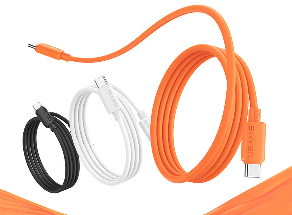 Na obrazie widoczne są trzy kable USB-C w kolorach czarnym, białym i pomarańczowym, z logo \'USAMS\' na złączach. Kable są zwinięte, a jeden z pomarańczowych kabli jest rozwinięty.