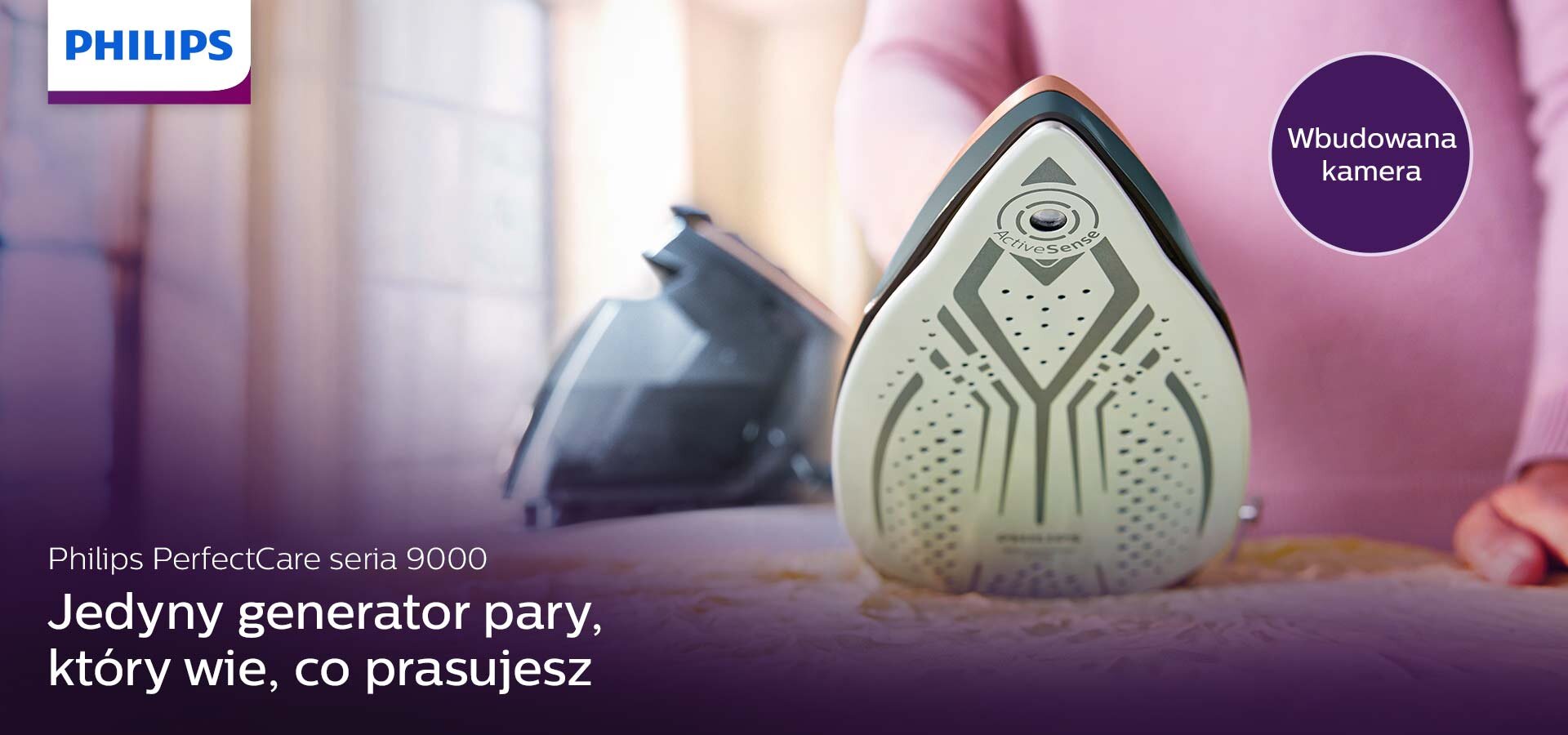 Na obrazie widoczny jest generator pary z napisem \'Philips PerfectCare seria 9000\'. Obok znajduje się tekst: \'Jedyny generator pary, który wie, co prasujesz\' oraz okrągły element z napisem \'Wbudowana kamera\'.