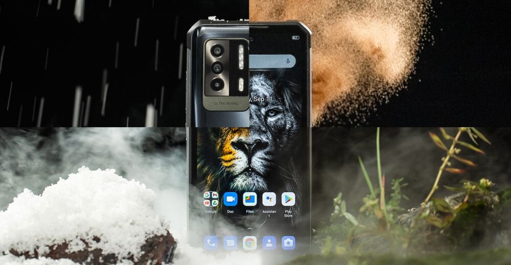 Smartfon z wyświetlaczem pokazującym obraz lwa, otoczony elementami natury jak śnieg i rośliny. Na ekranie widoczne są ikony aplikacji oraz data \'Sep 11\'.