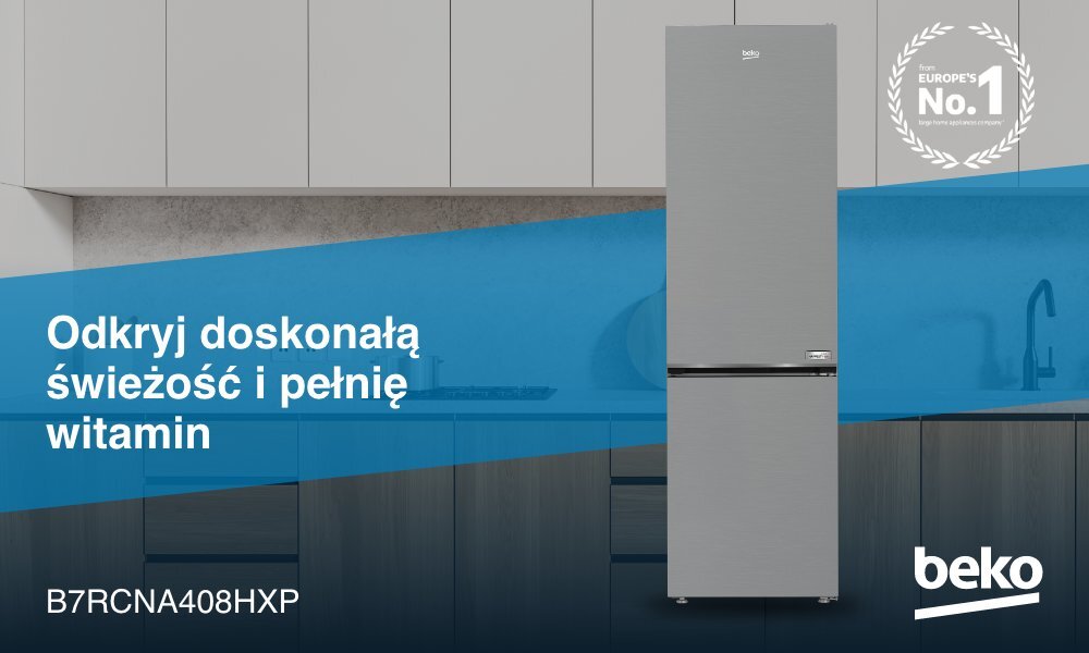 Na obrazie znajduje się lodówka w kolorze inox, umieszczona w nowoczesnej kuchni. Widoczny tekst: \'Odkryj doskonałą świeżość i pełnię witamin\', \'B7RCNA408HXP\', \'beko\'.
