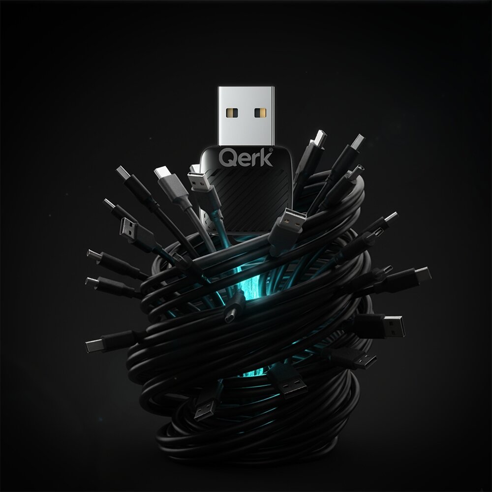 Na obrazie widoczny jest adapter USB z napisem \'Qerk\', otoczony spiralnie zwiniętymi kablami z różnymi końcówkami. W tle widać niebieskie światło, które podkreśla centralny element kompozycji.