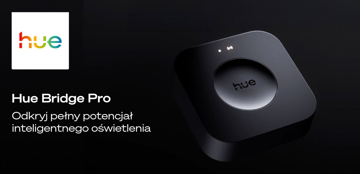 Obraz przedstawia czarne urządzenie z napisem \'hue\' na środku, obok którego znajduje się tekst: \'Hue Bridge Pro Odkryj pełny potencjał inteligentnego oświetlenia\'. W lewym górnym rogu widoczne jest kolorowe logo z napisem \'hue\'.