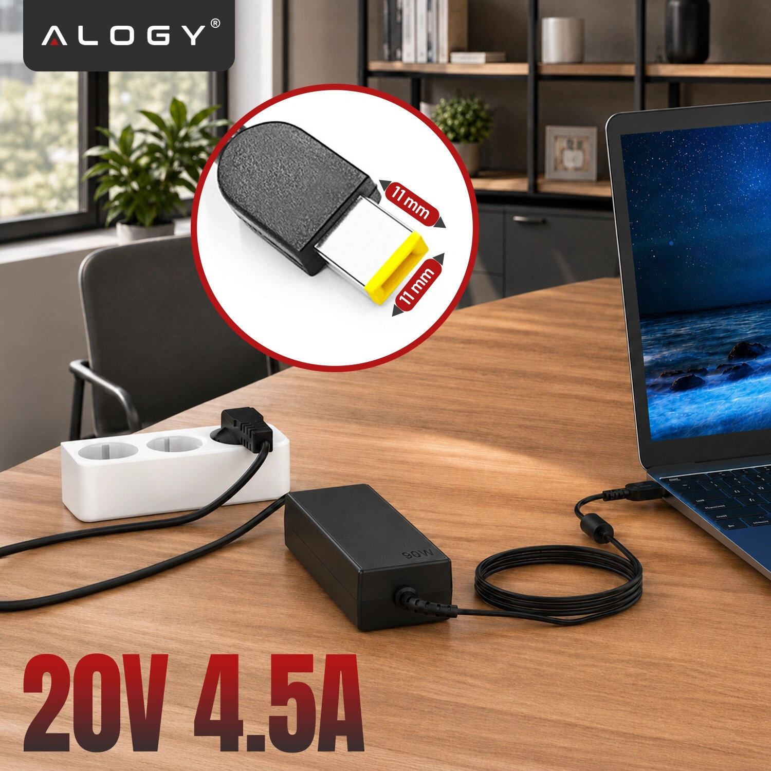 Na drewnianym stole znajduje się czarny zasilacz podłączony do laptopa oraz białej listwy zasilającej. W lewym górnym rogu widoczne jest logo \'ALOGY\', a na dole napis \'20V 4.5A\'.