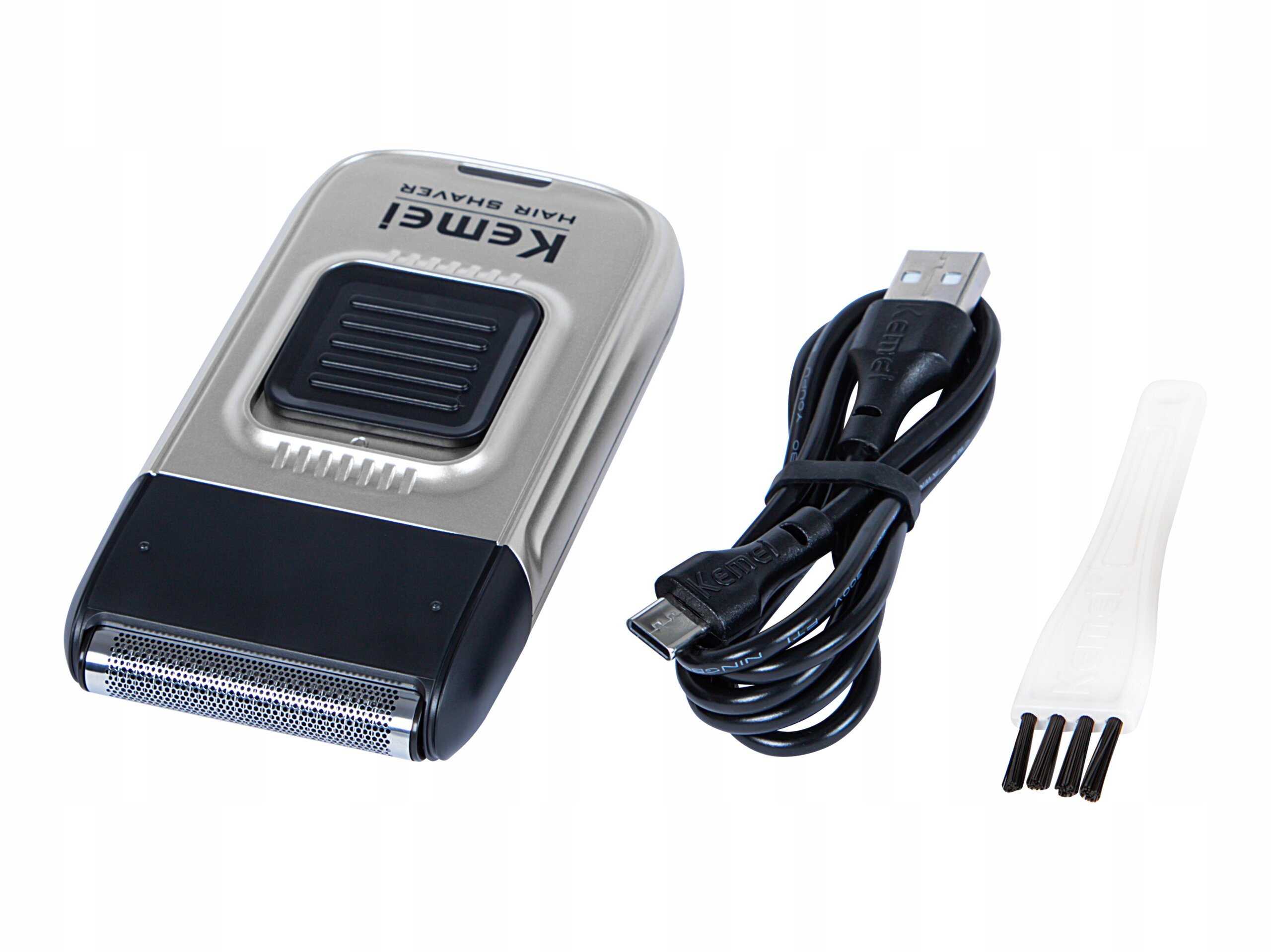 Na obrazie znajduje się elektryczna golarka foliowa z napisem \'Kemei HAIR SHAVER\', kabel USB oraz mała szczoteczka do czyszczenia.
