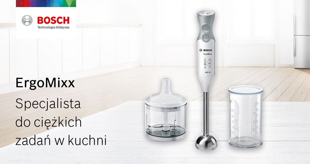 Na obrazie znajduje się blender ręczny z logo BOSCH, obok pojemnik z ostrzem i miarka. Tekst na obrazie: \'ErgoMixx Specjalista do ciężkich zadań w kuchni\'.