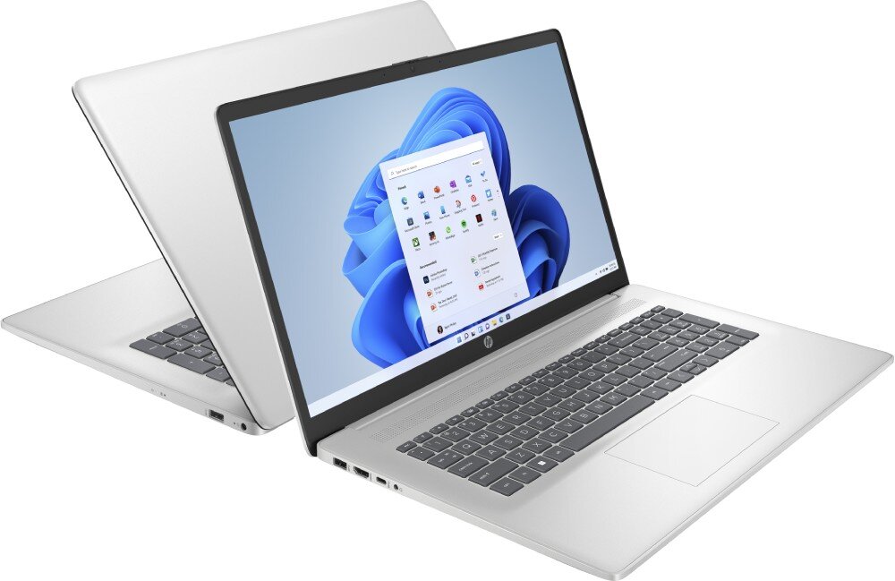Na obrazie widoczne są dwa laptopy w kolorze srebrnym, z otwartymi ekranami wyświetlającymi interfejs systemu Windows. Na obudowie laptopów znajduje się logo HP.