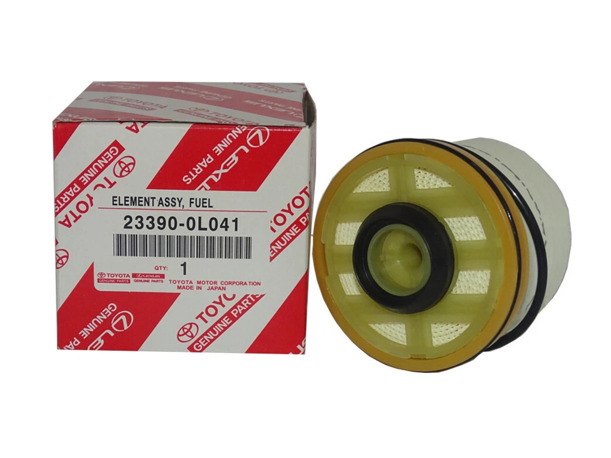 Na zdjęciu znajduje się filtr paliwa oraz pudełko z napisem \'ELEMENT ASSY, FUEL 23390-0L041\'. Pudełko ma czerwono-białe wzory z logo \'TOYOTA\' i napisami \'GENUINE PARTS\'.