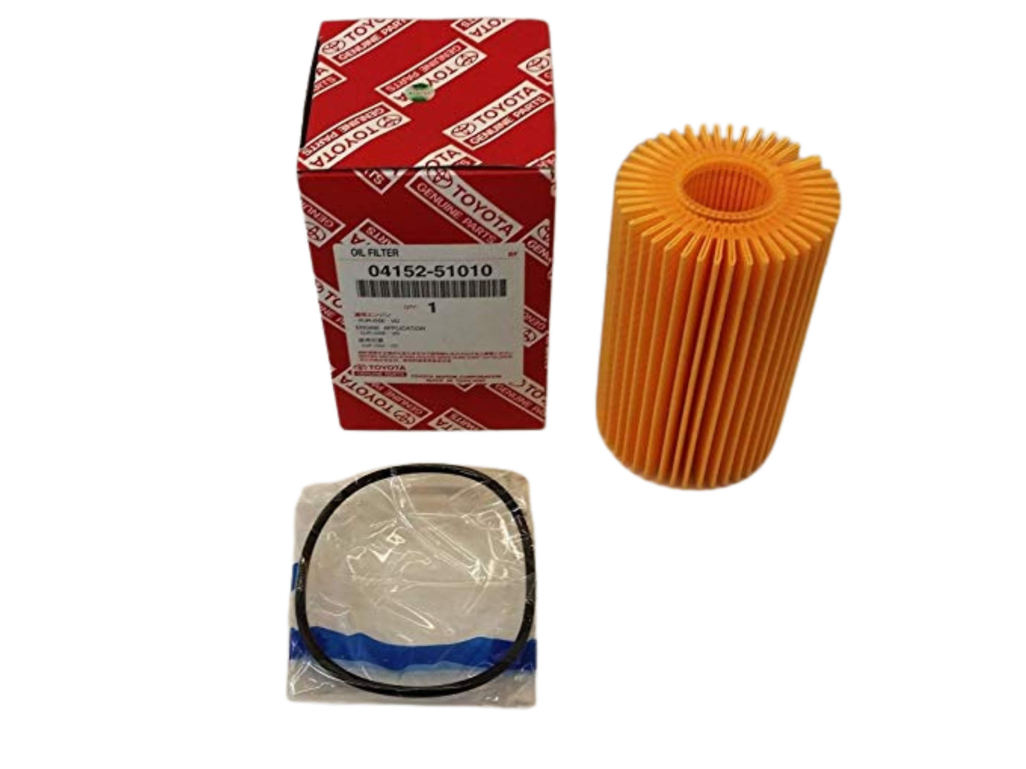 Na obrazie znajduje się pomarańczowy filtr oleju obok czerwonego pudełka z logo Toyota i numerem 04152-51010. Obok leży zapakowana uszczelka w plastikowej torebce.