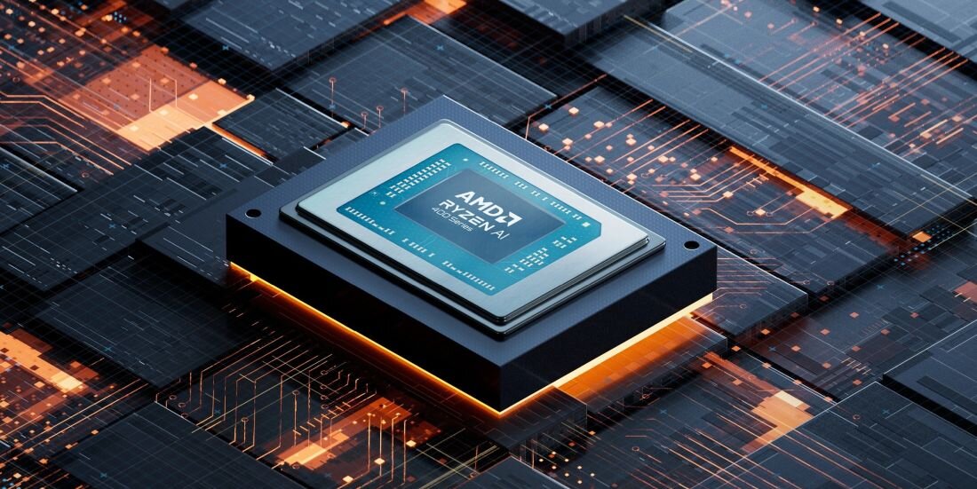 Obraz przedstawia procesor z widocznym napisem \'AMD Ryzen\' umieszczony na tle schematycznej siatki obwodów elektronicznych. Procesor jest podświetlony pomarańczowym światłem.