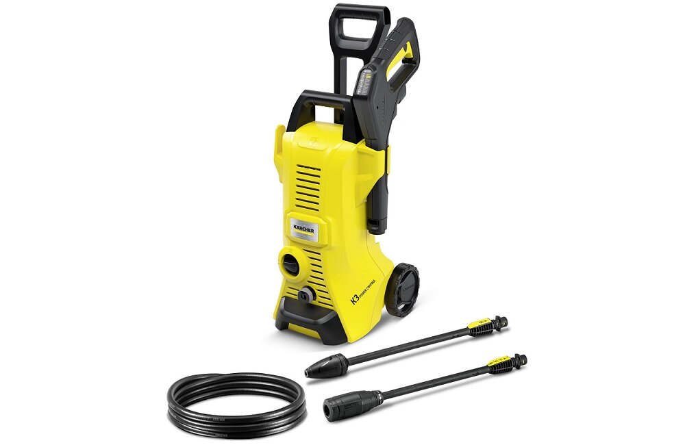 Na obrazie znajduje się żółta myjka ciśnieniowa z czarnymi elementami, dwie lancy oraz czarny wąż. Na urządzeniu widoczne jest logo \'KARCHER\'.