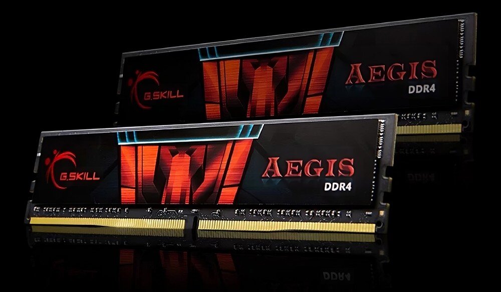 Dwa moduły pamięci RAM z widocznymi napisami \'G.SKILL\' i \'AEGIS DDR4\' na czarnym tle z czerwonymi i niebieskimi elementami graficznymi.