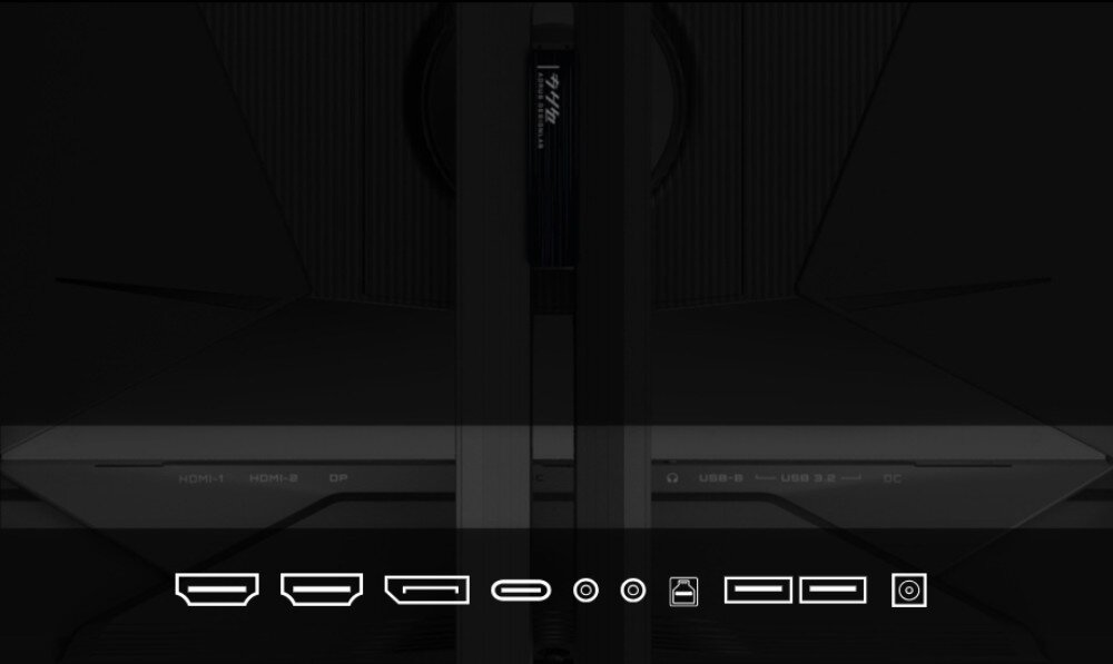 Obraz przedstawia tylną część monitora z widocznymi portami: HDMI, DisplayPort, USB-C, audio oraz zasilania. Na monitorze widoczny jest tekst: \'HDMI 1, HDMI 2, DP, USB-B, USB 3.0, DC\'.