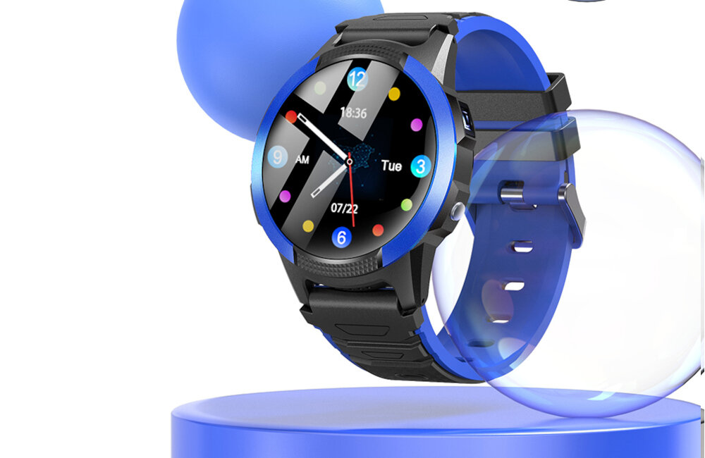 Smartwatch z niebieską obudową i czarnym paskiem, wyświetlający kolorową tarczę z godziną 18:36, datą 07/22 oraz dniem tygodnia \'Tue\'.