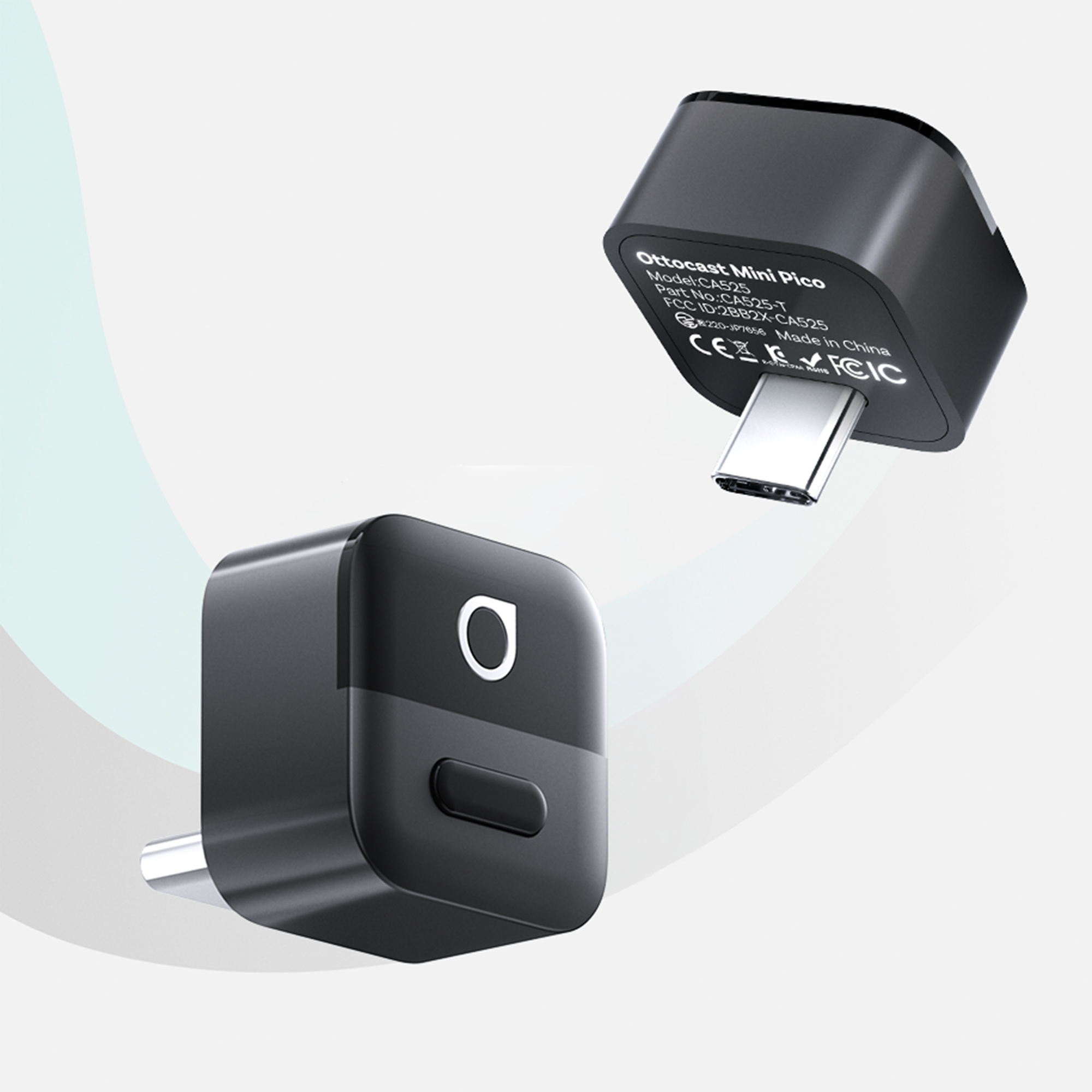 Na obrazie widoczne są dwa czarne adaptery USB-C z logo w kształcie litery \'O\'. Jeden z adapterów ma widoczny napis \'Ottocast Mini Pico\'.
