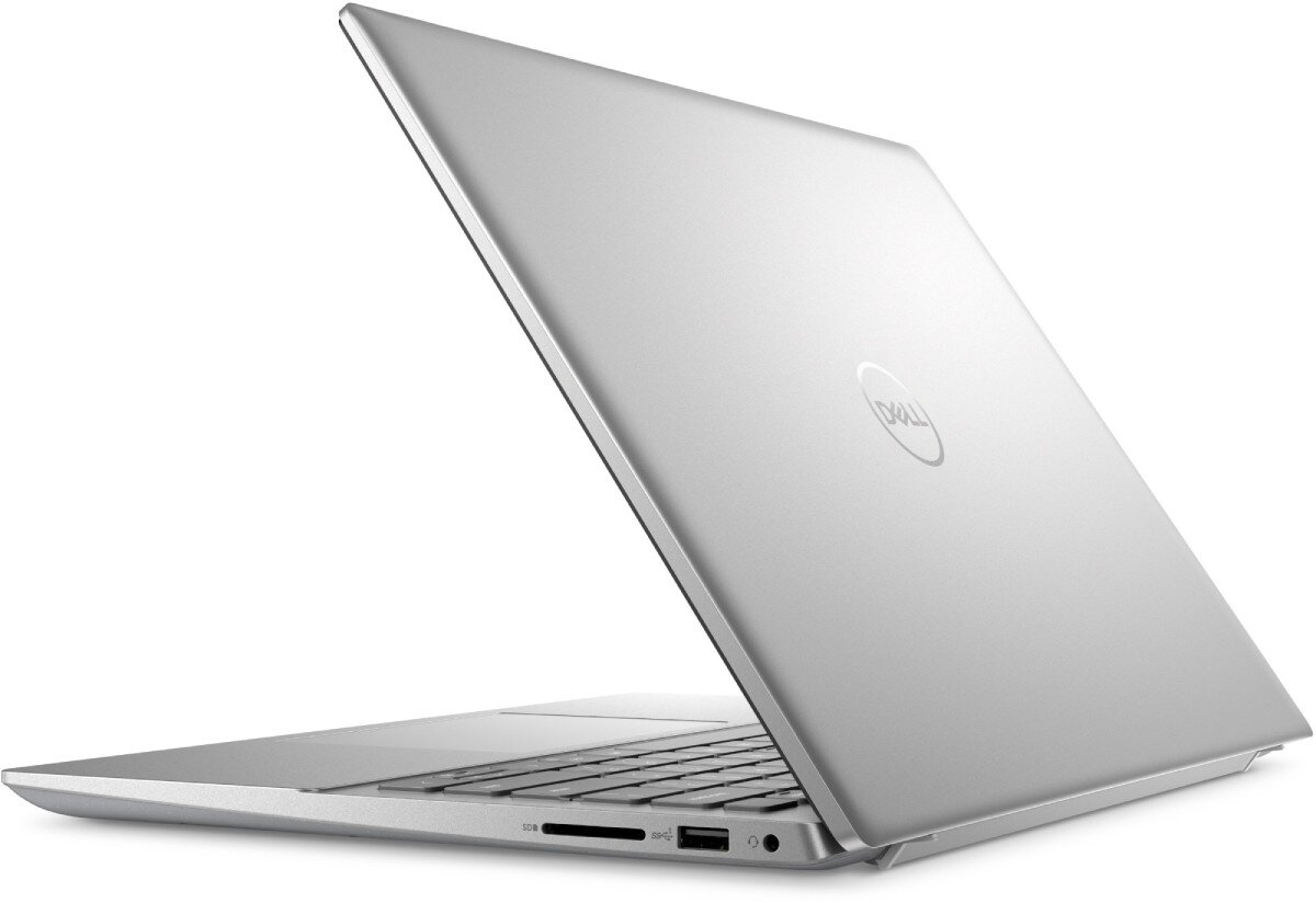 Srebrny laptop z logo \'DELL\' na pokrywie, widoczny z boku. Urządzenie jest otwarte, ukazując klawiaturę i porty po jednej stronie.