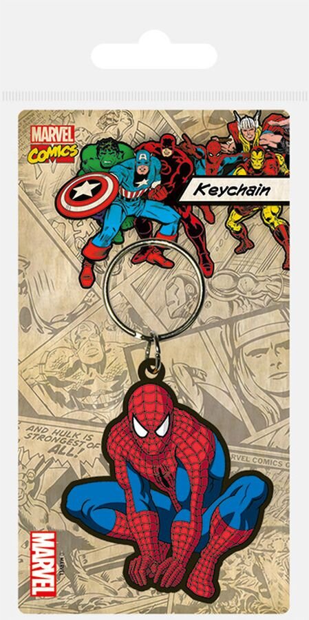 Gumowy brelok przedstawiający postać Spider-Mana w dynamicznej pozie, na tle komiksowych ilustracji z innymi superbohaterami. Widoczne napisy to \'Marvel Comics\', \'Keychain\' oraz \'Marvel\'.