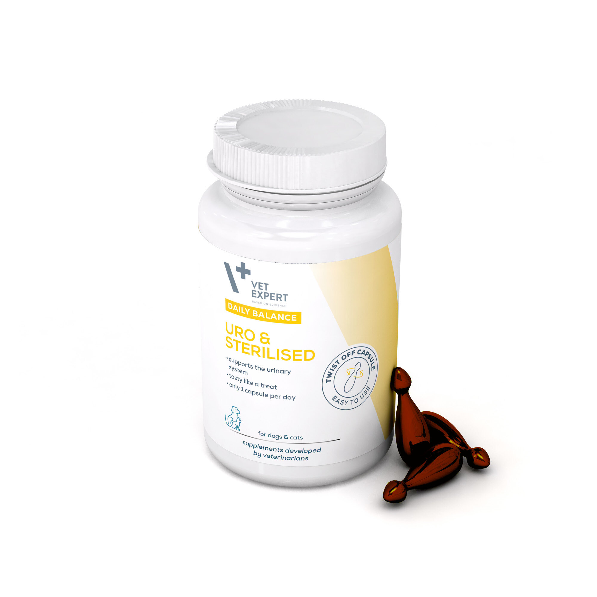 Biała butelka z żółtą etykietą zawierającą tekst: \'VET EXPERT DAILY BALANCE URO & STERILISED supports the urinary system tasty like a treat only 1 capsule per day for dogs & cats supplements developed by veterinarians\'. Obok butelki znajdują się trzy brązowe kapsułki.