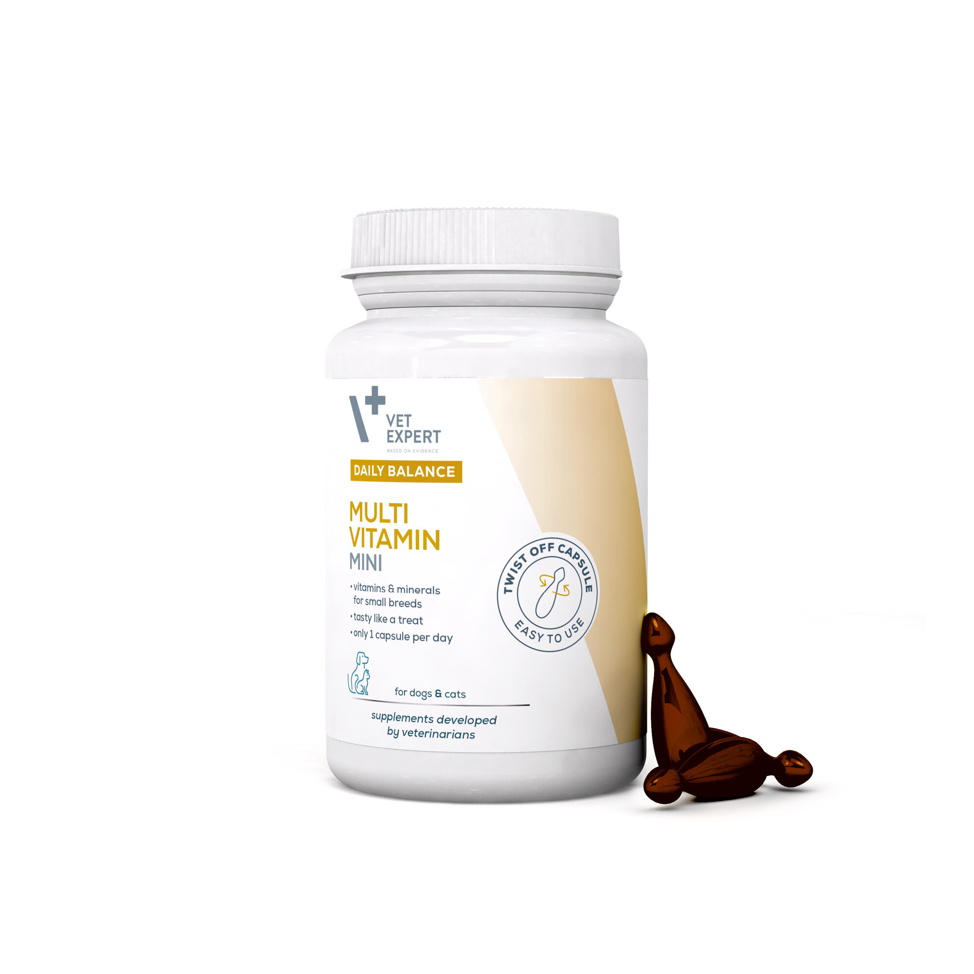 Biała butelka z etykietą \'Vet Expert Daily Balance Multi Vitamin Mini\' oraz kapsułka obok. Etykieta zawiera informacje o witaminach i minerałach dla małych ras psów i kotów.