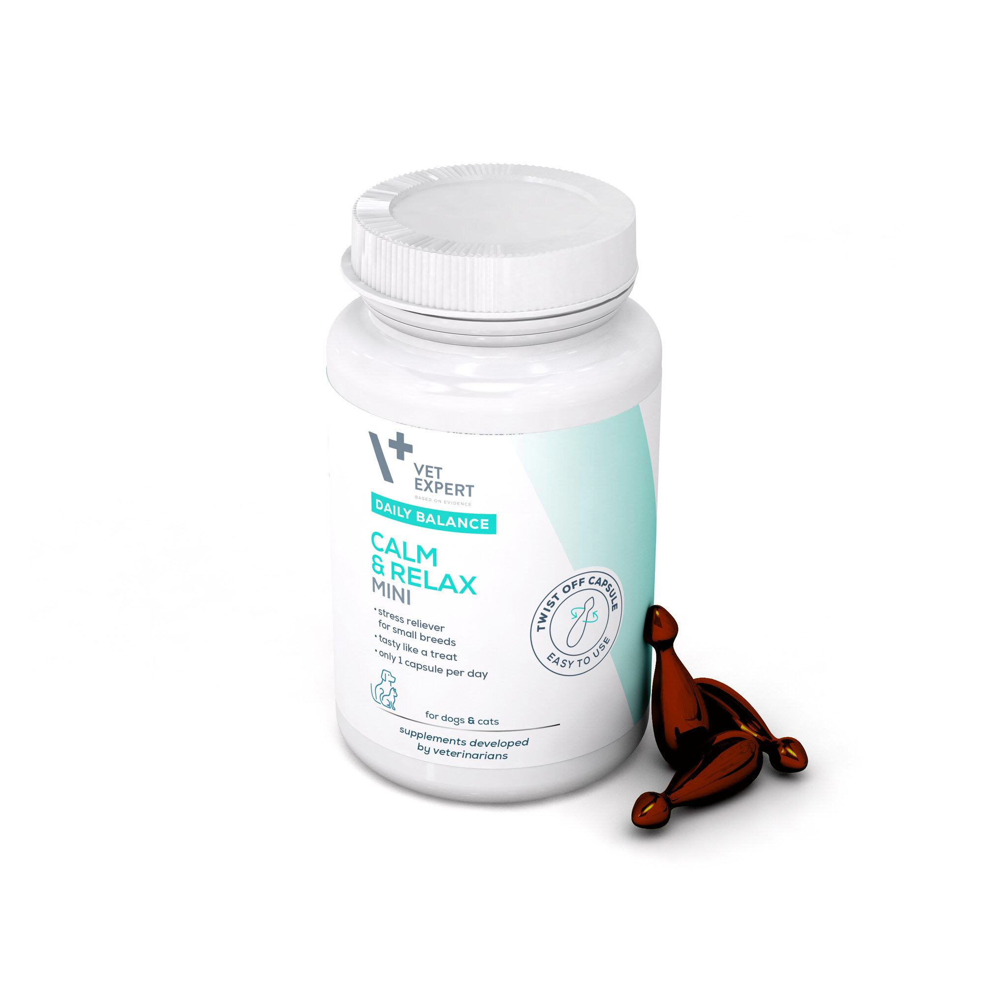 Biały pojemnik z etykietą \'Vet Expert Daily Balance Calm & Relax Mini\' oraz dwie brązowe kapsułki obok. Etykieta zawiera informacje o produkcie dla psów i kotów, z napisem \'Twist off capsule, easy to use\'.