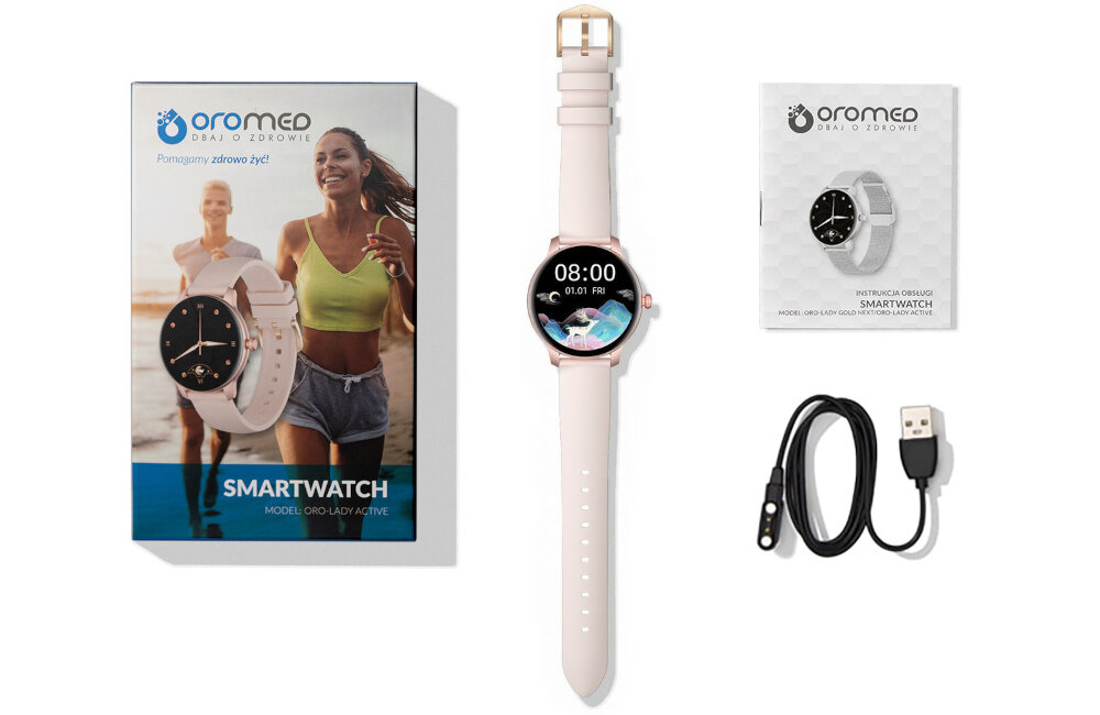 Na obrazie znajduje się smartwatch z różowym paskiem, obok pudełko z napisem \'SMARTWATCH MODEL: ORO-LADY ACTIVE\' oraz instrukcja obsługi i kabel USB. Na pudełku widoczne jest logo \'oromed dbaj o zdrowie\' i zdjęcie dwóch osób biegnących.